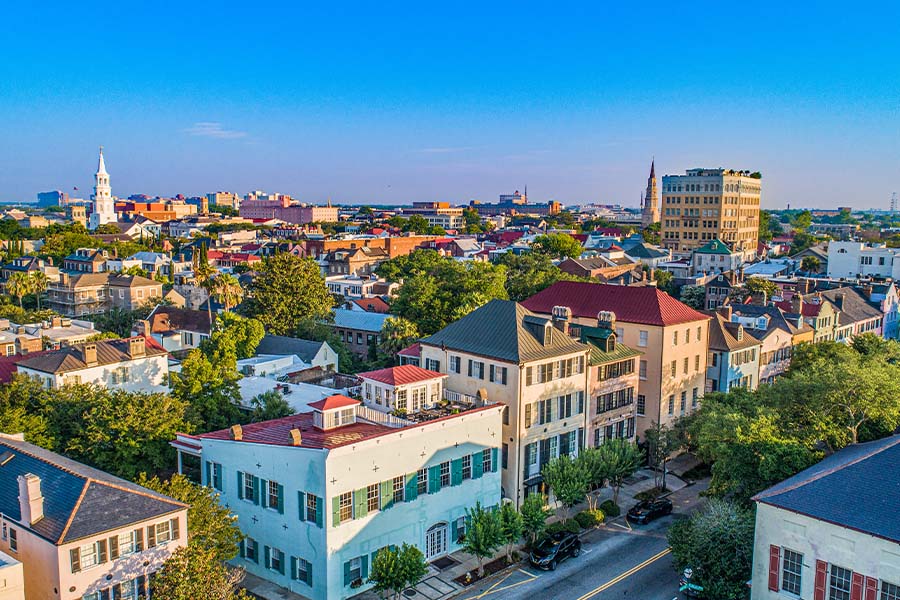Contact - Aerial View of City and Rainbow Row in Charleston, South Carolina at Sunset