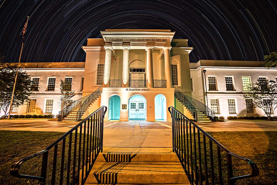 Walterboro, SC - View of the Town and Courthouse of Walterboro, South Carolina at Night with Star Trails in the Background