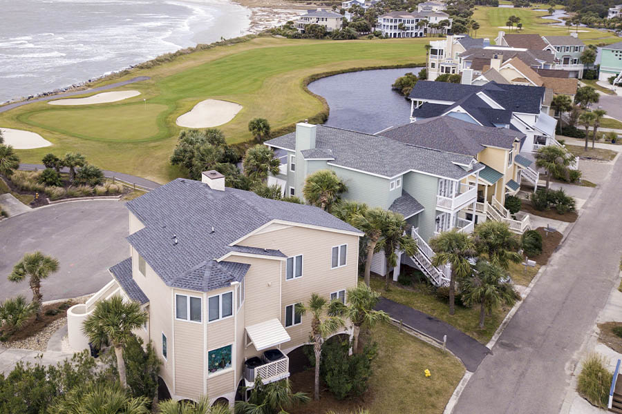 Coastal Insurance - Aerial View of Resort with Ocean View and Golf Course in South Carolina