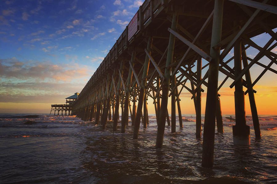 Homepage - Sunset Over Folly Beach Pier in Charleston County, South Carolina